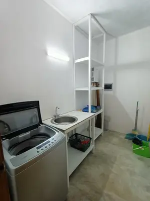a small kitchen with a sink and a washing machine at Apartment Mariquita in Las Terrenas