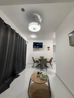 a living room with a table and a dining room at Moon Apartamento C2 in San Cristóbal