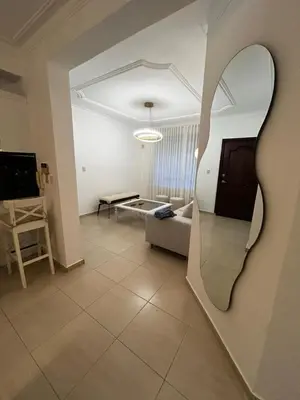 a living room with a large mirror on the wall at Residencial ambar lll in Santiago de los Caballeros