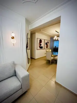 a living room with a couch and a table at Residencial ambar lll in Santiago de los Caballeros
