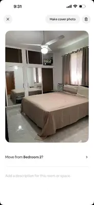 a bedroom with a large bed in a room at Lissette altagracia in Concepción de La Vega