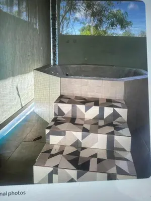 a bath tub in a room with a window at Lissette altagracia in Concepción de La Vega