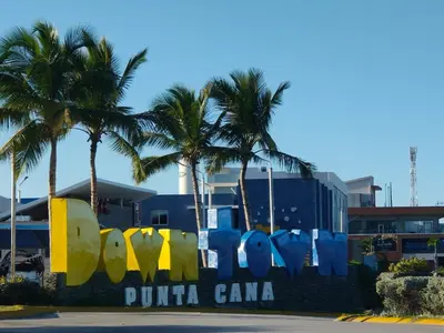 a sign that says punta cana in front of palm trees at Pure relax in Bavaro La Casita de Giò in Punta Cana