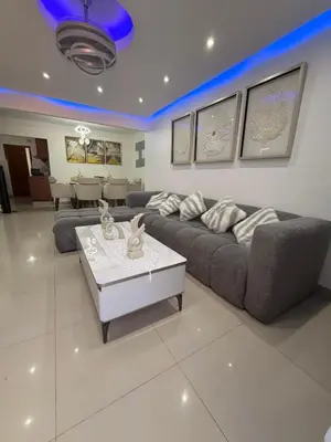 a living room with a couch and a table at Apartamento de lujos Avenida España