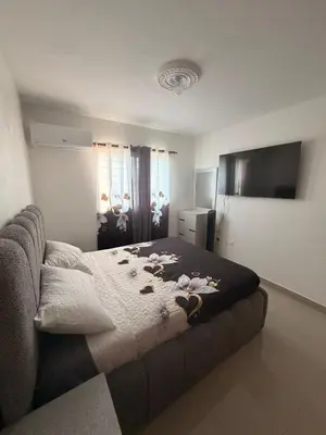 a bedroom with a bed with rocks on it at Apartamento de lujos Avenida España