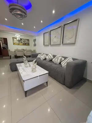 a living room with a couch and a table at Santo domingo Avenida España