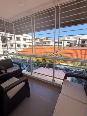a living room with a view of a building at Santo domingo Avenida España