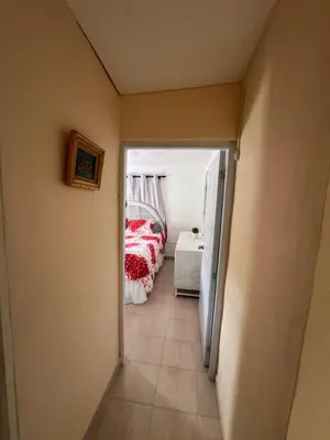 a hallway leading to a bedroom with a bed at Casa de campo El Bonao in Higuey