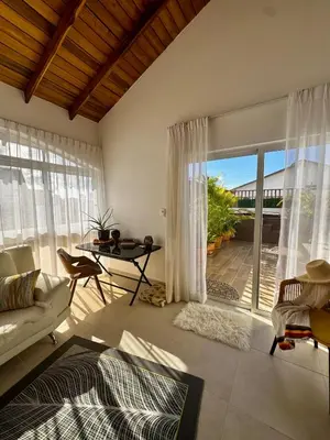 a living room with a couch and a table at Penthouse with Jacuzzi Near Beach in Las Terrenas