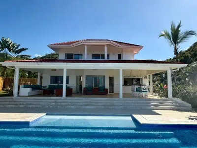 a house with a swimming pool in front of a house at Villa Bella Vista - Luxury Ocean View and Private Pool, Las Terrenas in Las Terrenas