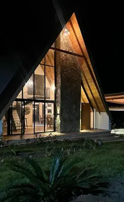 a large house with glass windows and a balcony at La gloria