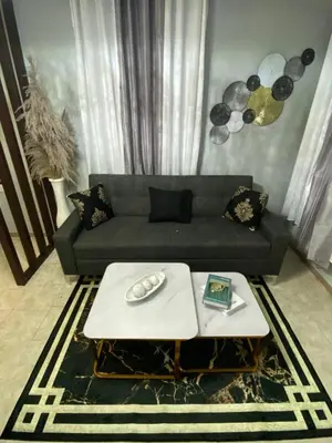 a living room with a couch and a table at Luxury and beautiful studio private jacuzzi in Santo Domingo