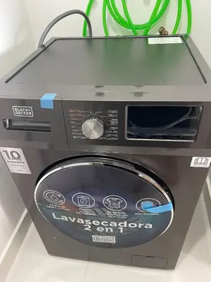 a microwave oven sitting on top of a counter at Mountain and pool modern apartment in Santiago de los Caballeros