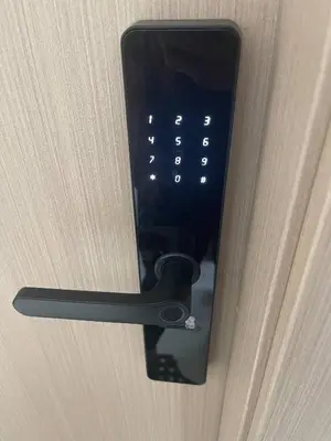 a close up of a door handle on a door at Mountain and pool modern apartment in Santiago de los Caballeros