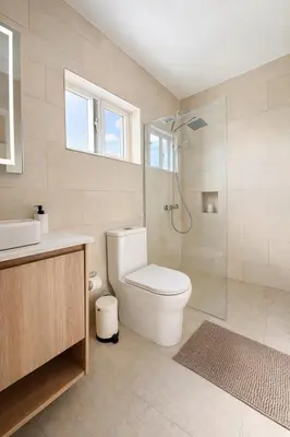 a bathroom with a toilet and a shower at Sunset Calm Penthouse in Cabarete