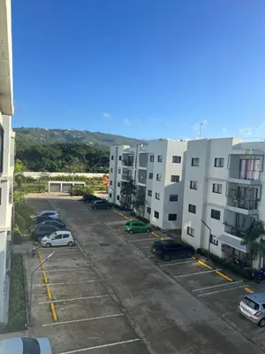 an aerial view of a parking lot with buildings at Oasis in Graditti valley in Santiago de los Caballeros