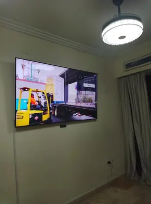 a flat screen tv hanging on a wall at Torre shalom in Santo Domingo