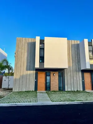 a building with a door on the side of it at Laggo one houses in Punta Cana