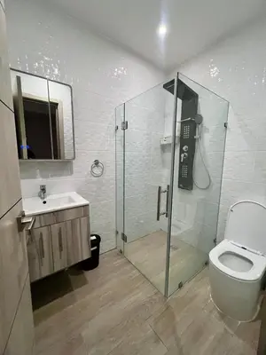 a bathroom with a shower and a toilet and a sink at Laggo one houses in Punta Cana