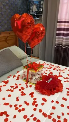 a table topped with red hearts on a bed at Luxury apartment private rooftop & jacuzzi in Santo Domingo