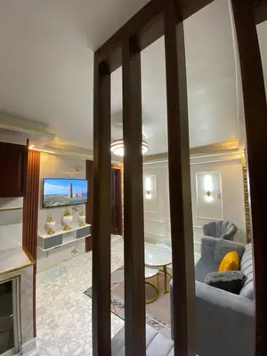 a living room with a couch and a table at Luxury Beautiful mini apartment Private jacuzzi in Santo Domingo