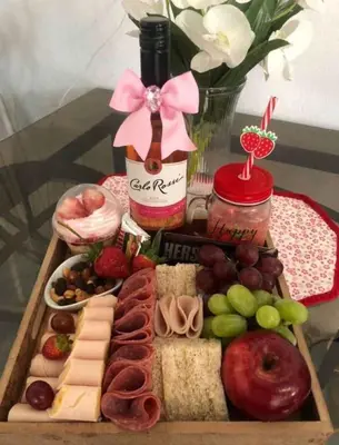 a tray of cheese and other foods on a table at Luxury Beautiful mini apartment Private jacuzzi in Santo Domingo