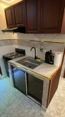 a kitchen with a sink and a stove at Luxury Beautiful mini apartment Private jacuzzi in Santo Domingo