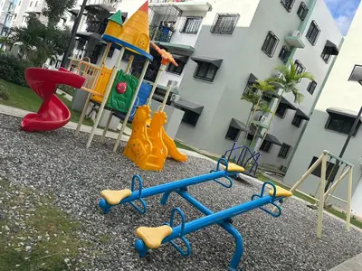 a group of childrens playground equipment in front of a building at Próximo al aeropuerto en santo domingo in La Javilla