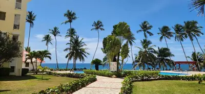 a view of the ocean from a resort at Apartamento frente al Mar y Piscina in Juan Dolio