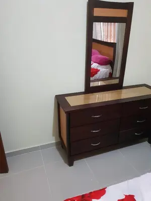 a dresser with a mirror on top of it at My house 56 in San Francisco de Macorís