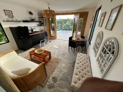 a living room with a couch and a table at Monte y Cielo 1 apartment in Las Galeras