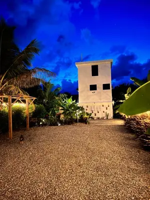a small white building on the beach at night at Monte y Cielo 1 apartment in Las Galeras