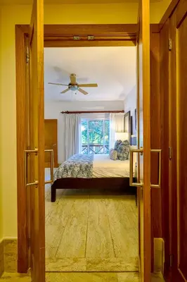 a bedroom with a bed and a window at ®2BR{Beach~Spot} @TerrenasJaccuziWalk~to~Beach in El Limón