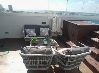 a living room with a couch and a table at Sky 01 M11 in Santo Domingo