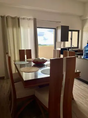 a dining room table and chairs in a kitchen at Civil tower oceance in Santo Domingo