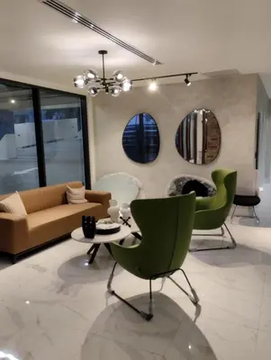 a living room with a couch and a table and chairs at Comfortable oceanfront apartment on Av España in La Francia