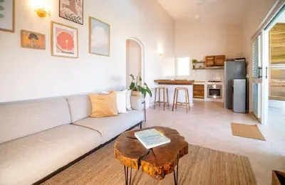 a living room with a couch and a table at Cultrera 1 in Las Terrenas