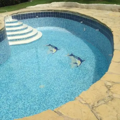three dolphins are swimming in a swimming pool at Villa Dawn, Bahia de Arena in Cabarete