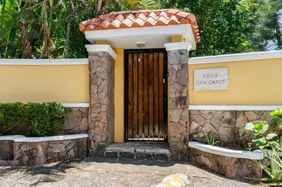 a door in a house with a sign on it at Villa Cancanet in Nizao