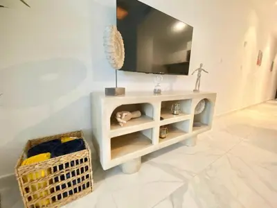 a white cabinet with a television on top of it at 1B Fantasy Lodge @t Canabay Private Pool and beach in Punta Cana