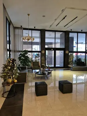 a living room with a large room with windows at Modern Luxury Apt Pool, Gym and Prime Location in La Julia