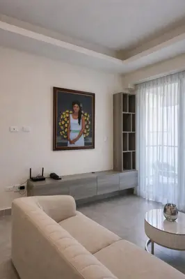 a living room with a couch and a table at Modern Luxury Apt Pool, Gym and Prime Location in La Julia