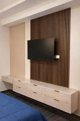 a flat screen tv on a wall at Modern Luxury Apt Pool, Gym and Prime Location in La Julia
