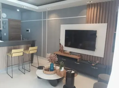 a living room with a tv and a table and chairs at Sky 01 M10 in Santo Domingo