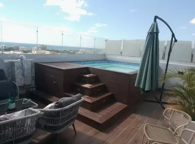 a swimming pool on the roof of a building at Sky 01 M10 in Santo Domingo