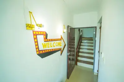 a hallway with a welcome sign on a wall at Luxury Caribbean penthouse in Santo Domingo