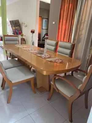 a dining room table with chairs and a wooden table at Casa a solo 30 minutos de la playa