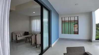 a living room with blue walls and a couch at Cigua Palmera 42 in Puerto Plata