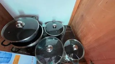 a group of four pots and pans in a room at Hideaway Studio - steps from Playa Encuentro at Cabarete in Cabarete