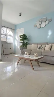 a living room with a couch and a coffee table at Cozy 2BR 2Bth walk 2 the beach Pool view Wi-Fi in Punta Cana